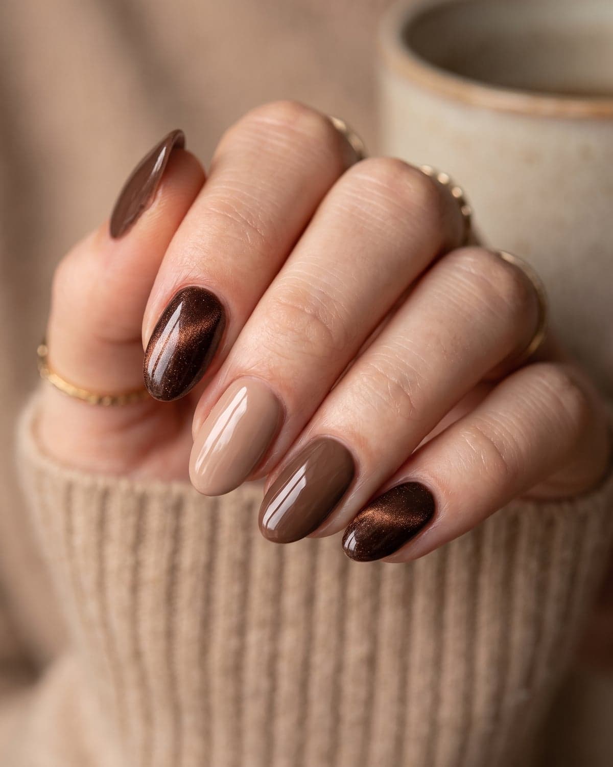 Espresso brown velvet and mocha oval nails on a warm neutral background